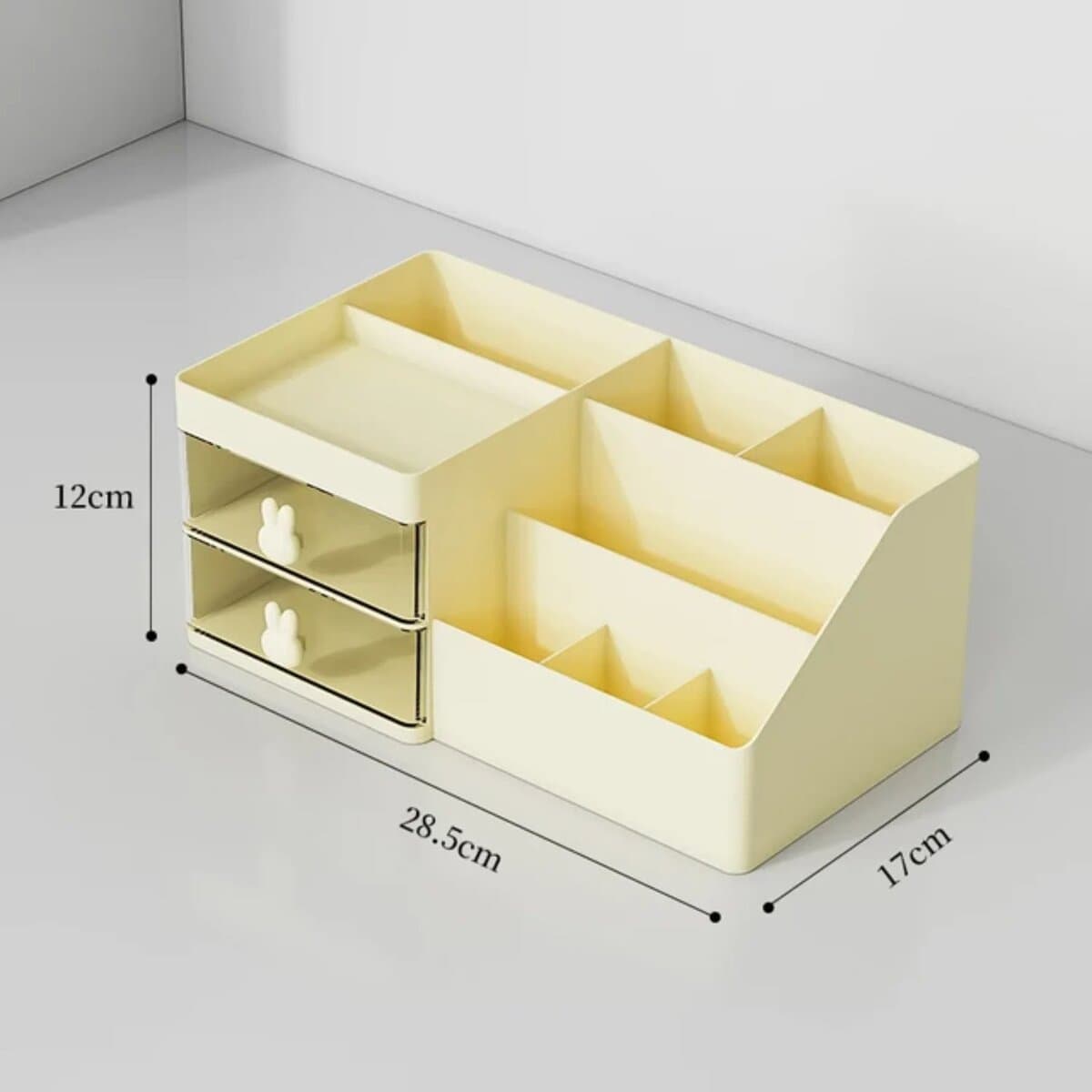 Boîte rangement maquillage beige avec tiroirs et compartiments.